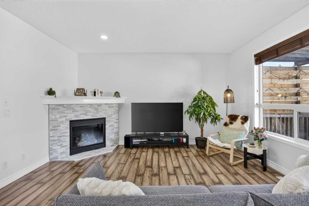 340 Prestwick Terrace Se, Calgary, AB - Indoor Photo Showing Living Room With Fireplace