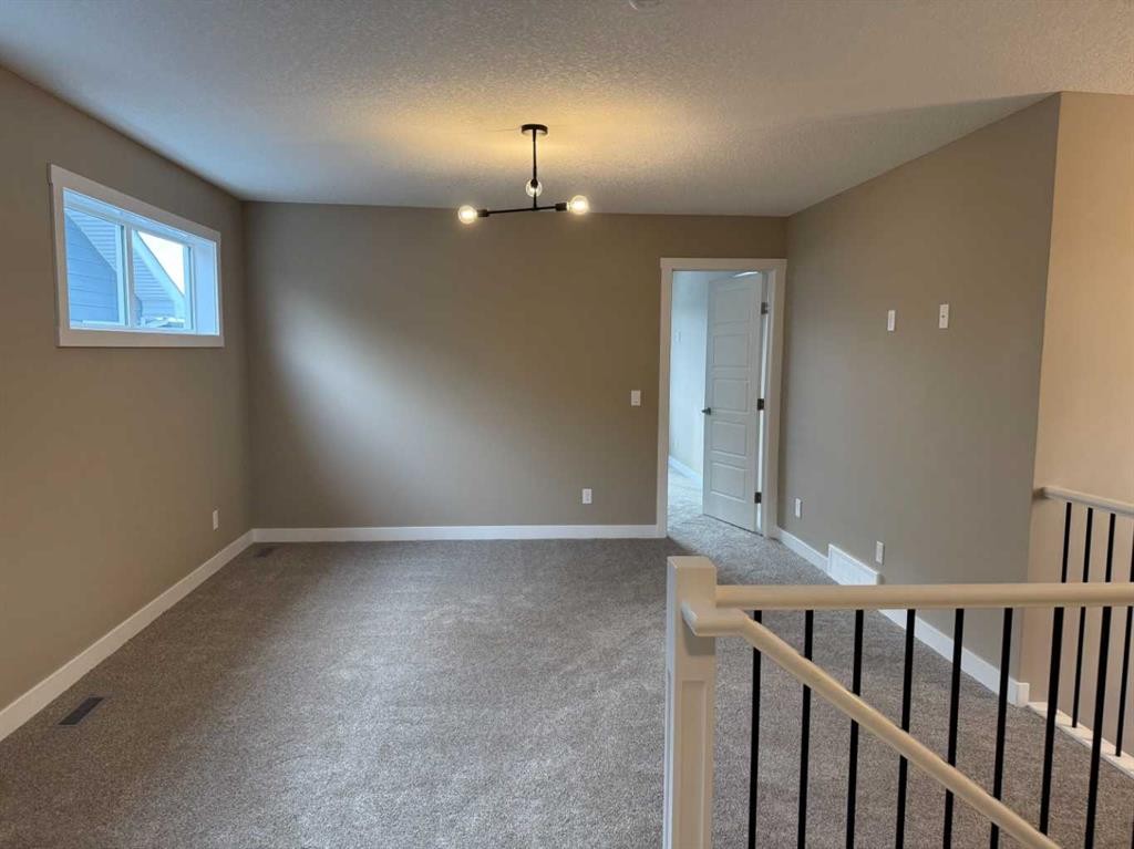 115 Sundown Crescent, Cochrane, AB - Indoor Photo Showing Other Room