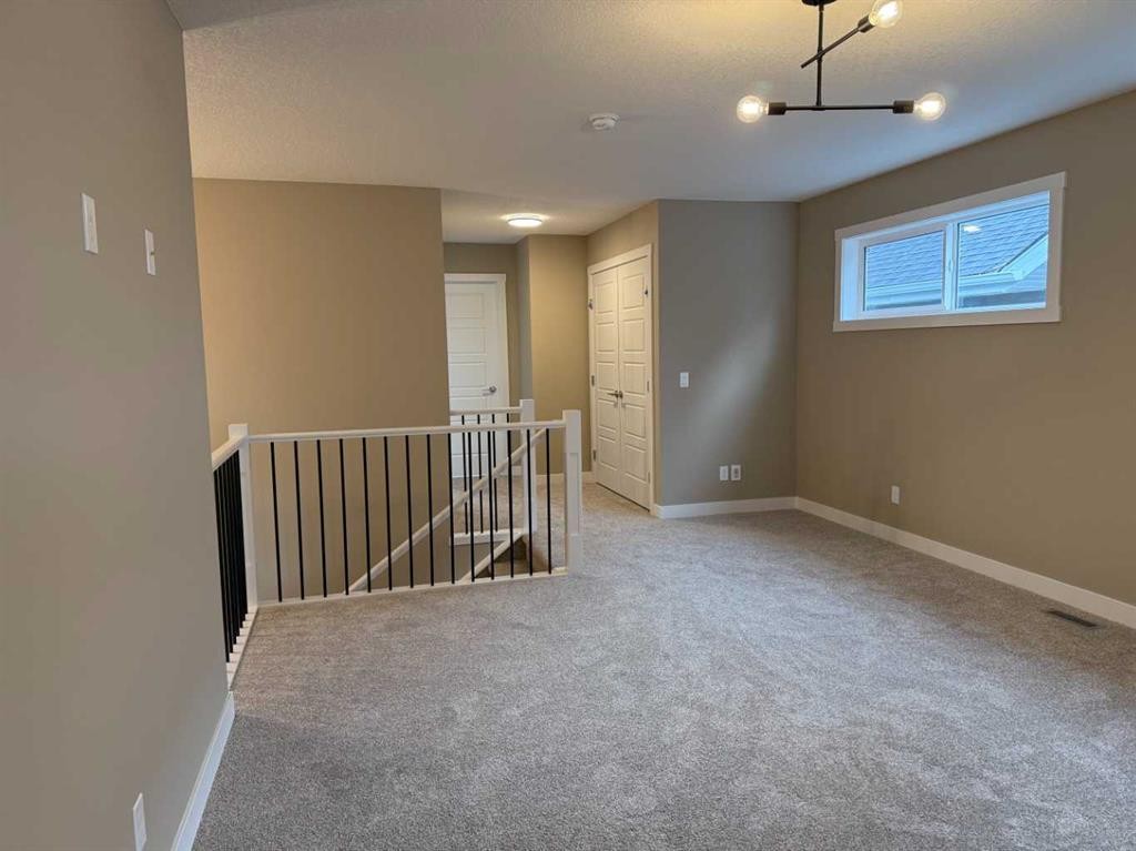 115 Sundown Crescent, Cochrane, AB - Indoor Photo Showing Other Room