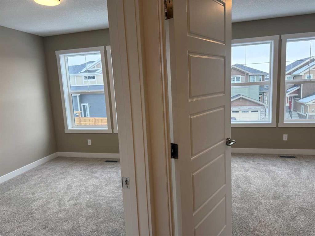 115 Sundown Crescent, Cochrane, AB - Indoor Photo Showing Other Room
