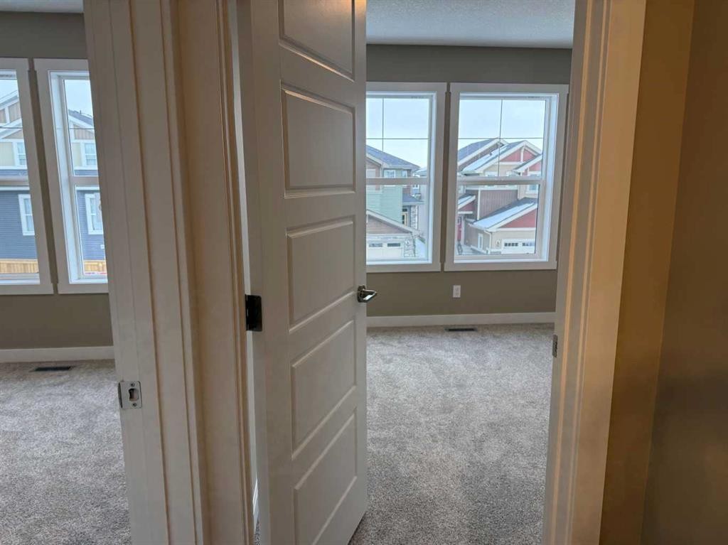 115 Sundown Crescent, Cochrane, AB - Indoor Photo Showing Other Room