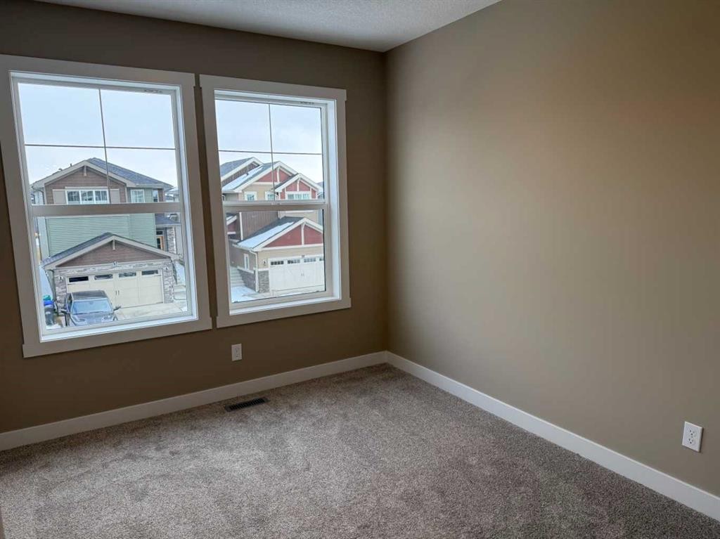 115 Sundown Crescent, Cochrane, AB - Indoor Photo Showing Other Room