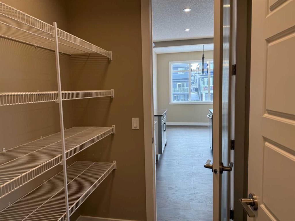 115 Sundown Crescent, Cochrane, AB - Indoor With Storage