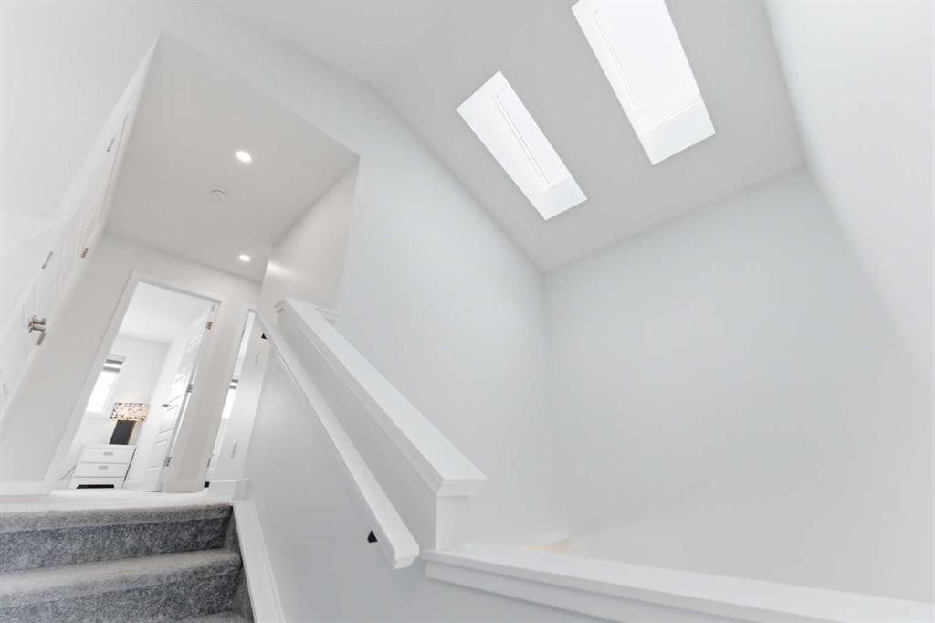 99 Aquila Way Nw, Calgary, AB - Indoor Photo Showing Other Room