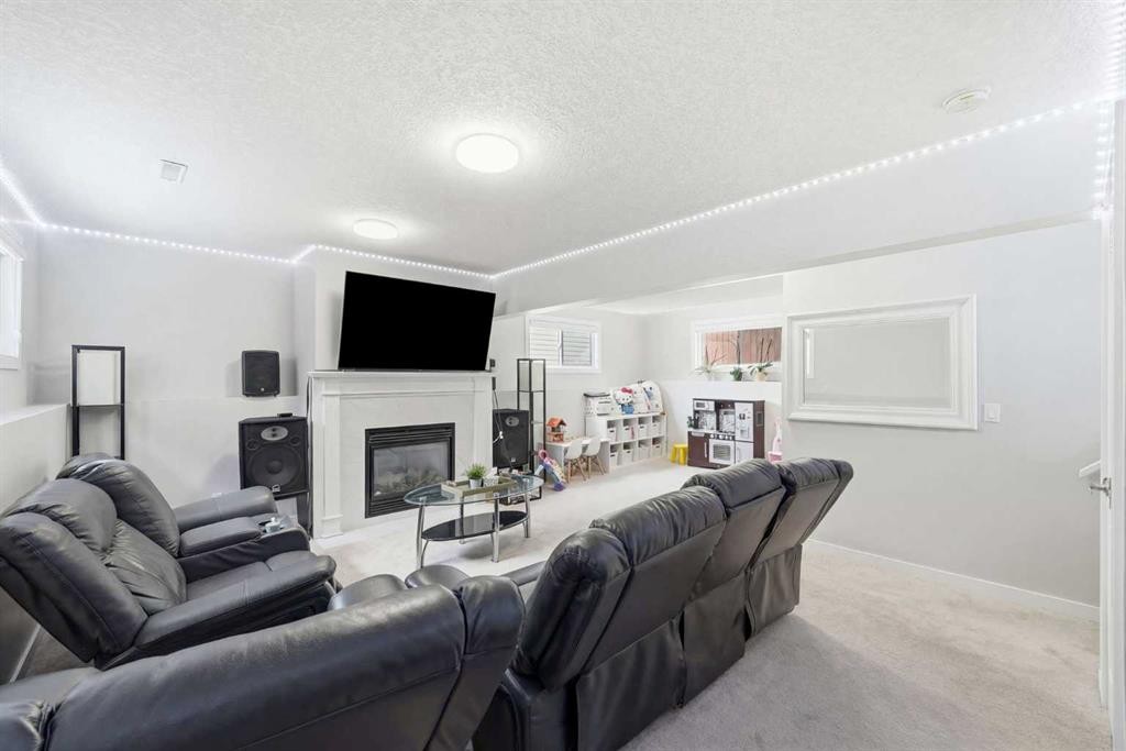 151 Templevale Place Ne, Calgary, AB - Indoor Photo Showing Living Room With Fireplace