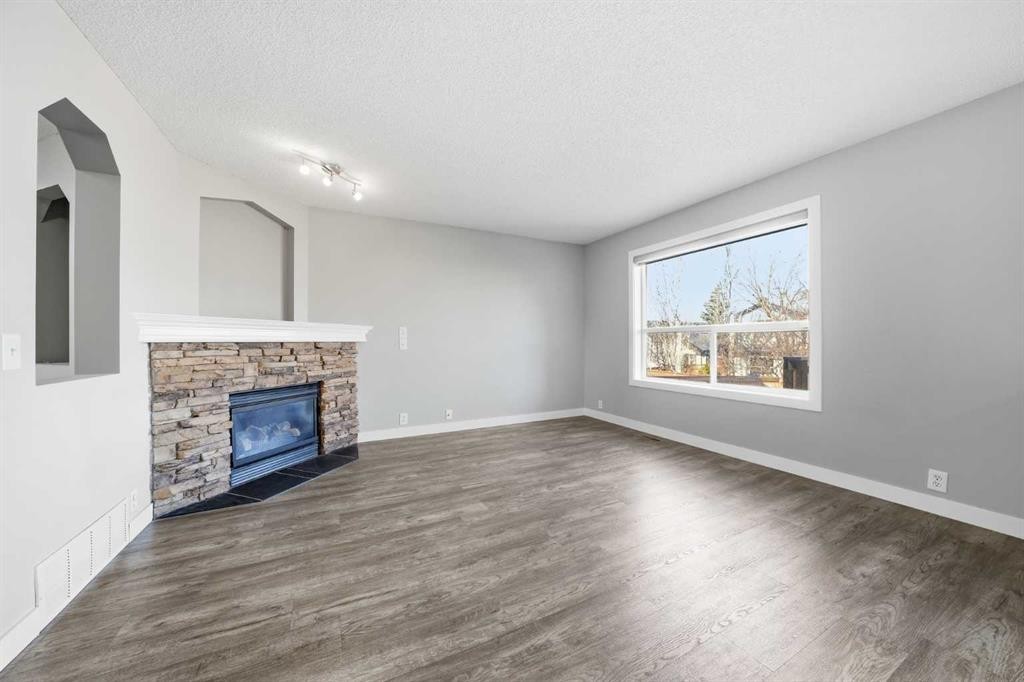 83 Cranfield Crescent Se, Calgary, AB - Indoor Photo Showing Living Room With Fireplace