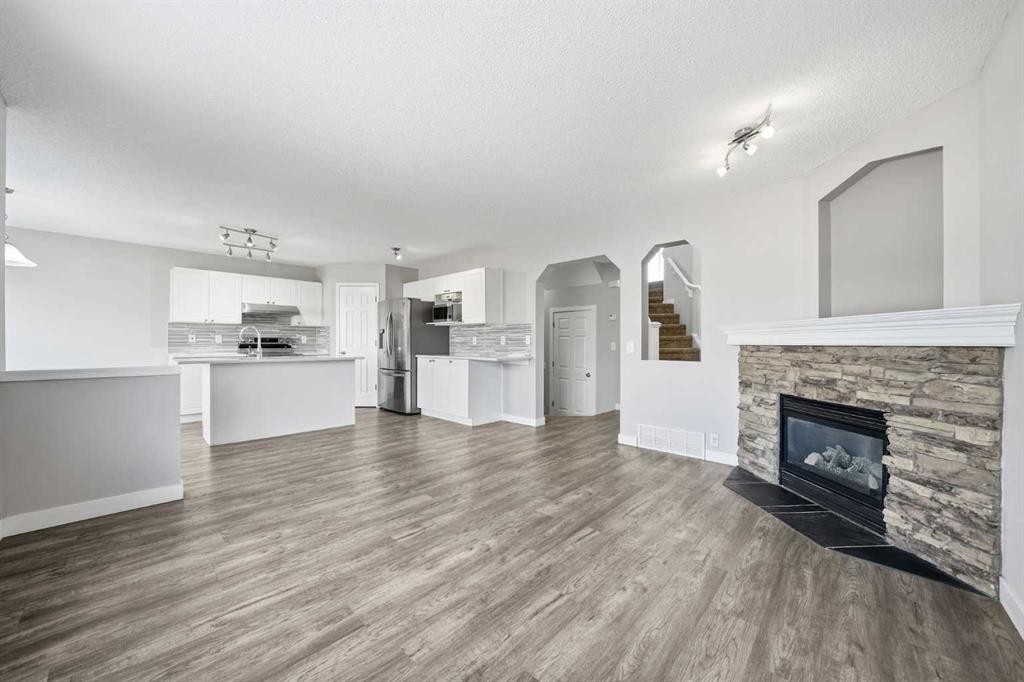 83 Cranfield Crescent Se, Calgary, AB - Indoor Photo Showing Living Room With Fireplace