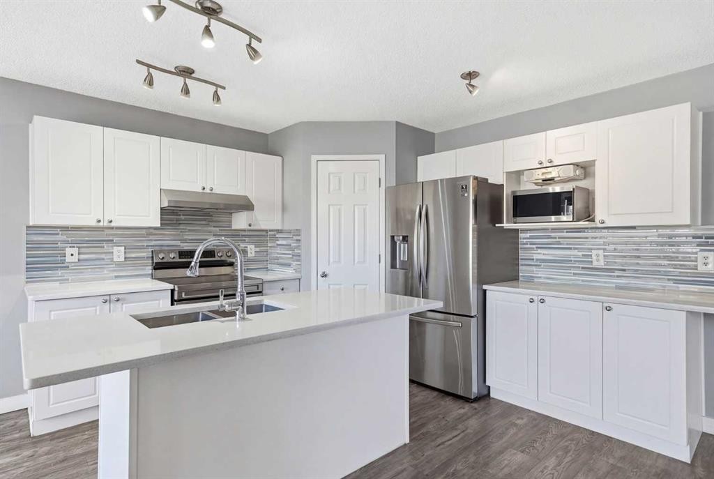 83 Cranfield Crescent Se, Calgary, AB - Indoor Photo Showing Kitchen With Double Sink With Upgraded Kitchen