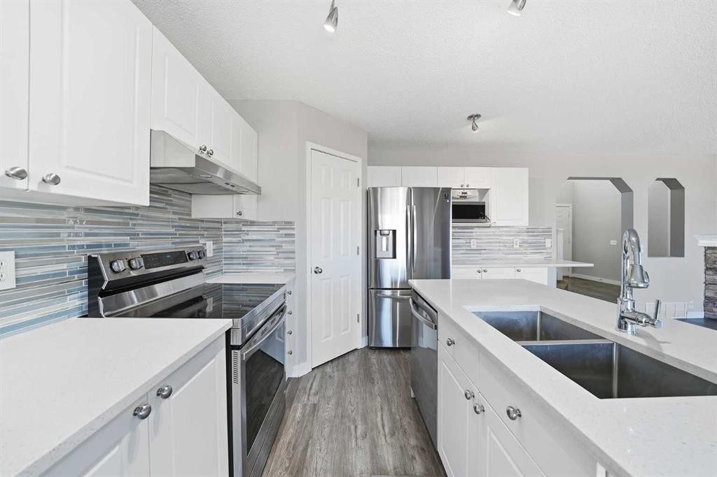 83 Cranfield Crescent Se, Calgary, AB - Indoor Photo Showing Kitchen With Double Sink With Upgraded Kitchen