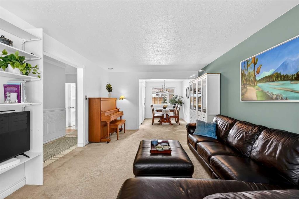 33 Warwick Drive Sw, Calgary, AB - Indoor Photo Showing Living Room With Fireplace