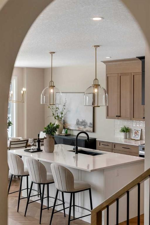 47 Sundown Crescent, Cochrane, AB - Indoor Photo Showing Kitchen With Upgraded Kitchen