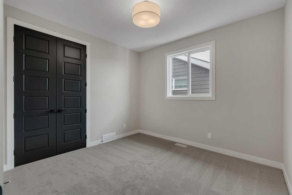 47 Sundown Crescent, Cochrane, AB - Indoor Photo Showing Other Room