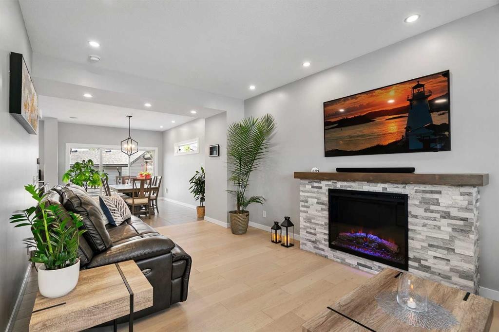 288 Copperstone Gardens Se, Calgary, AB - Indoor Photo Showing Living Room With Fireplace