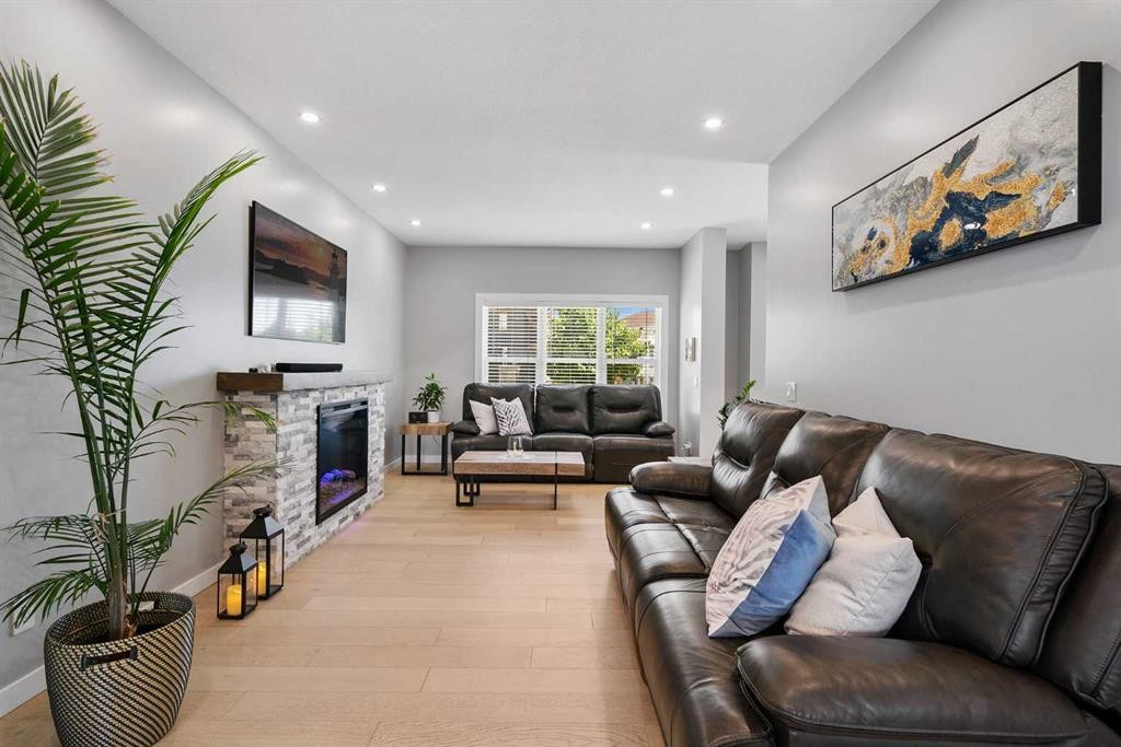 288 Copperstone Gardens Se, Calgary, AB - Indoor Photo Showing Living Room With Fireplace