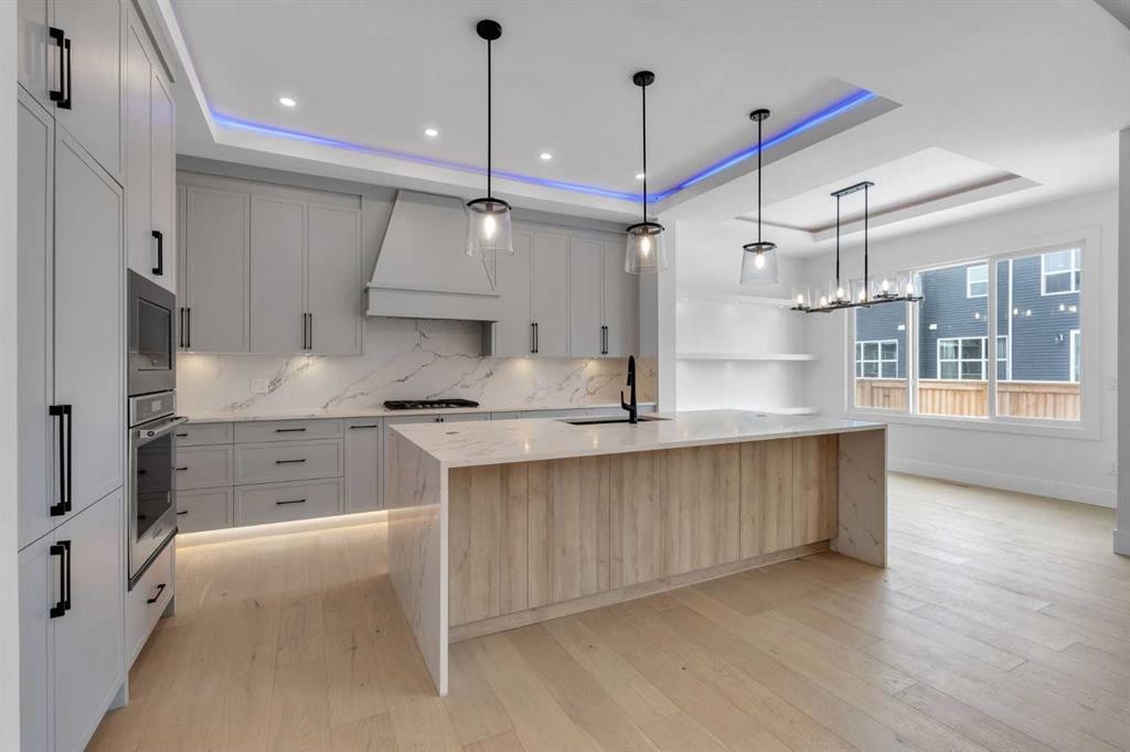 223 Kinniburgh Loop, Chestermere, AB - Indoor Photo Showing Kitchen With Upgraded Kitchen