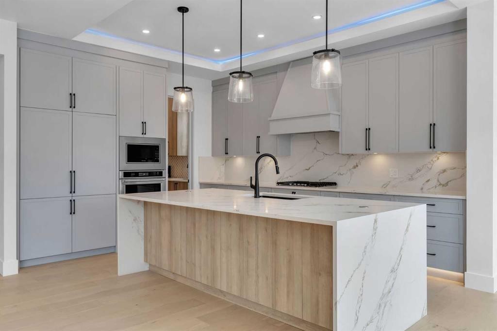 223 Kinniburgh Loop, Chestermere, AB - Indoor Photo Showing Kitchen With Upgraded Kitchen