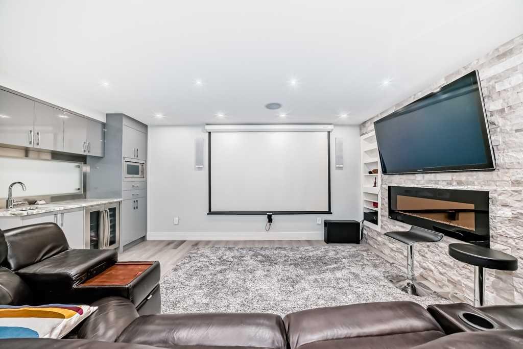 256 Riverside Mews Se, Calgary, AB - Indoor Photo Showing Other Room With Fireplace