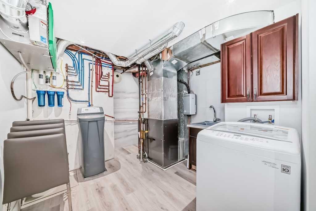 256 Riverside Mews Se, Calgary, AB - Indoor Photo Showing Laundry Room