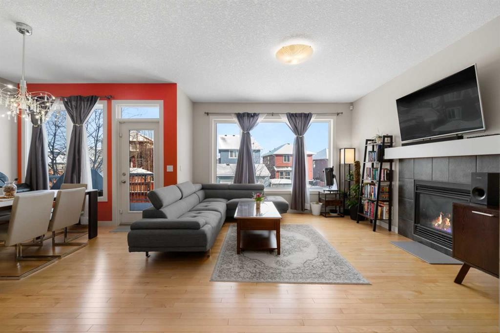 151 Heritage View, Cochrane, AB - Indoor Photo Showing Living Room With Fireplace