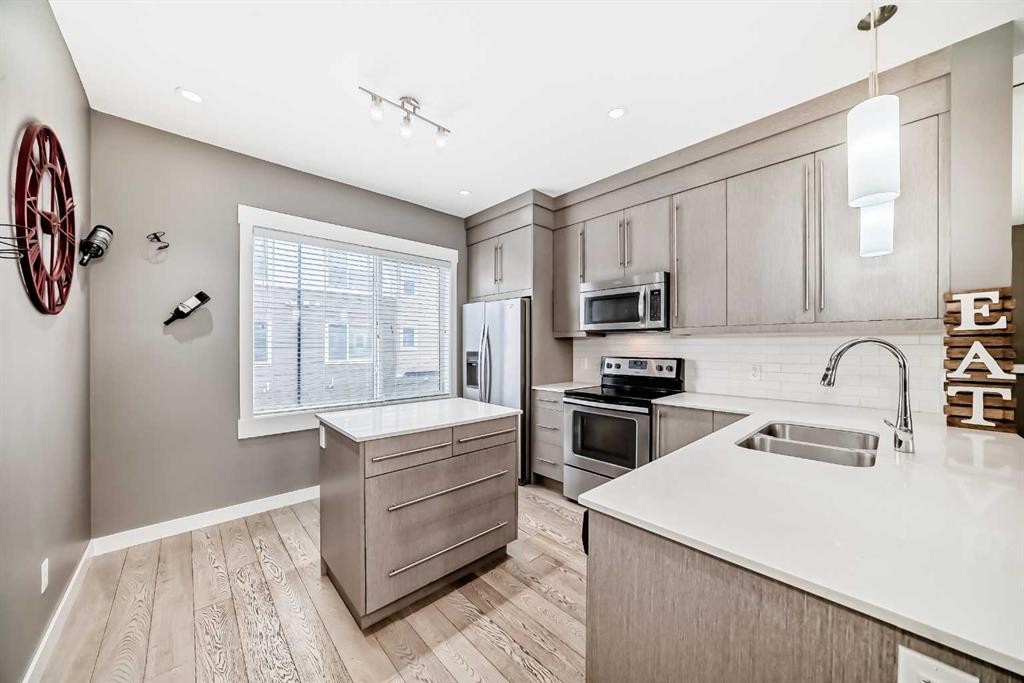 53-111 Rainbow Falls, Chestermere, AB - Indoor Photo Showing Kitchen With Double Sink With Upgraded Kitchen