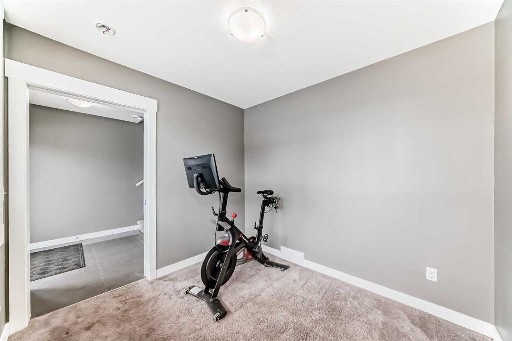 53-111 Rainbow Falls, Chestermere, AB - Indoor Photo Showing Gym Room