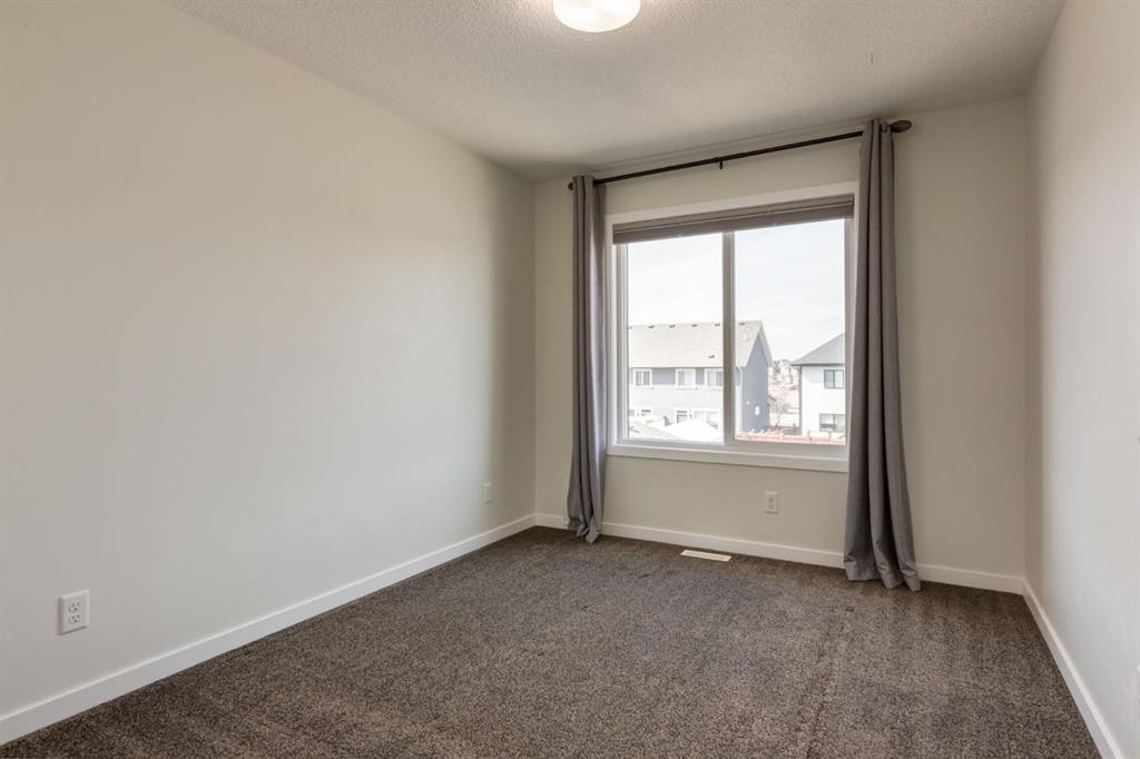 28 Masters Link Se, Calgary, AB - Indoor Photo Showing Other Room