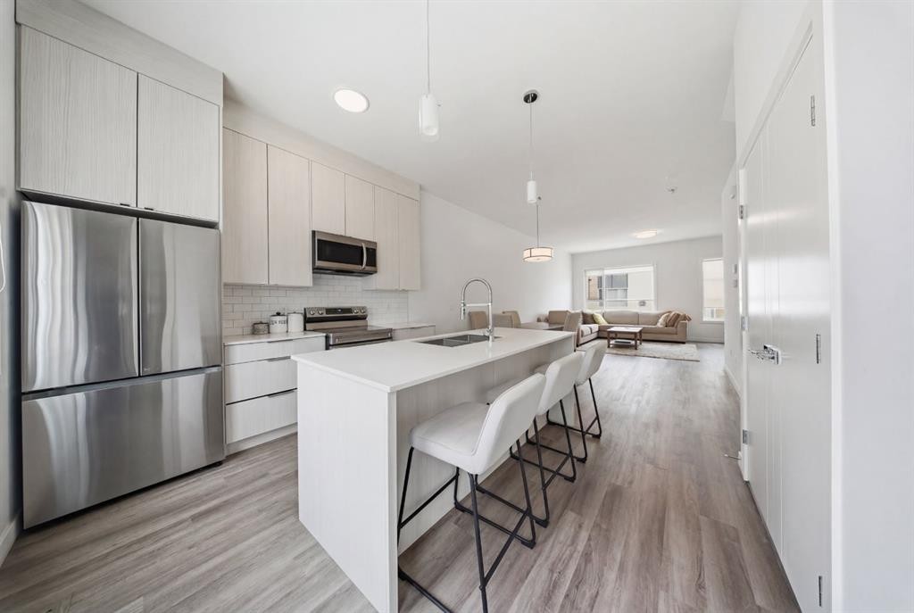 505-101 Panatella Square Nw, Calgary, AB - Indoor Photo Showing Kitchen With Stainless Steel Kitchen With Upgraded Kitchen