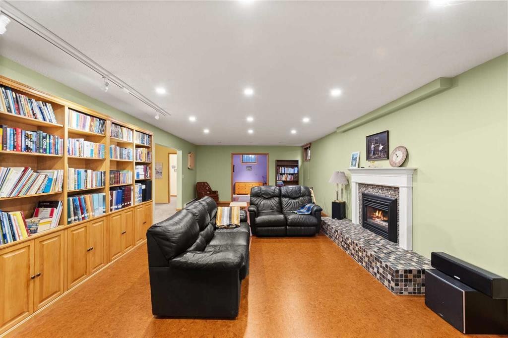 25 Westheights Drive, Didsbury, AB - Indoor With Fireplace