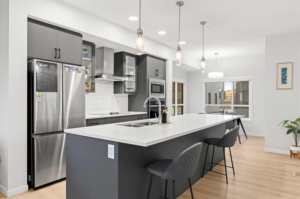 617-20295 Seton Way Se, Calgary, AB - Indoor Photo Showing Kitchen With Double Sink With Upgraded Kitchen