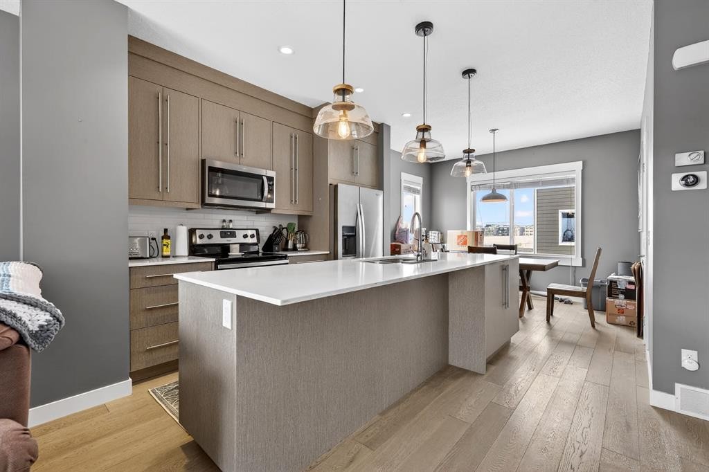 43-111 Rainbow Falls Gate, Chestermere, AB - Indoor Photo Showing Kitchen With Stainless Steel Kitchen With Upgraded Kitchen