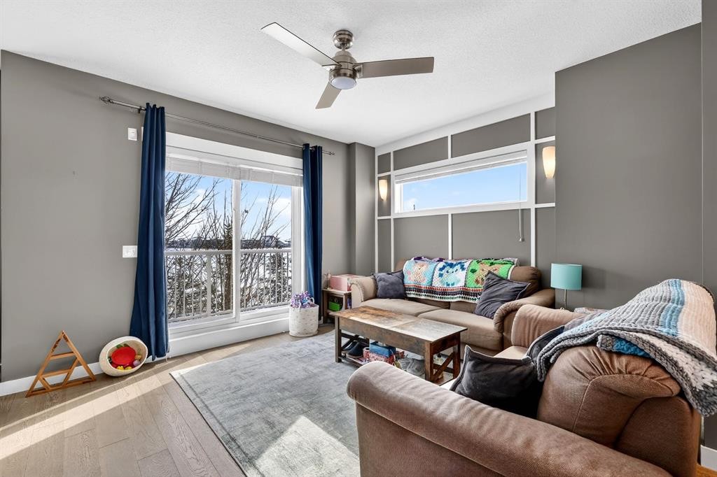 43-111 Rainbow Falls Gate, Chestermere, AB - Indoor Photo Showing Living Room