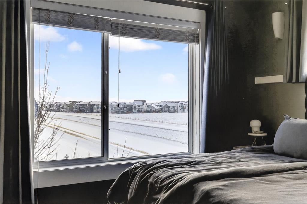 43-111 Rainbow Falls Gate, Chestermere, AB - Indoor Photo Showing Bedroom