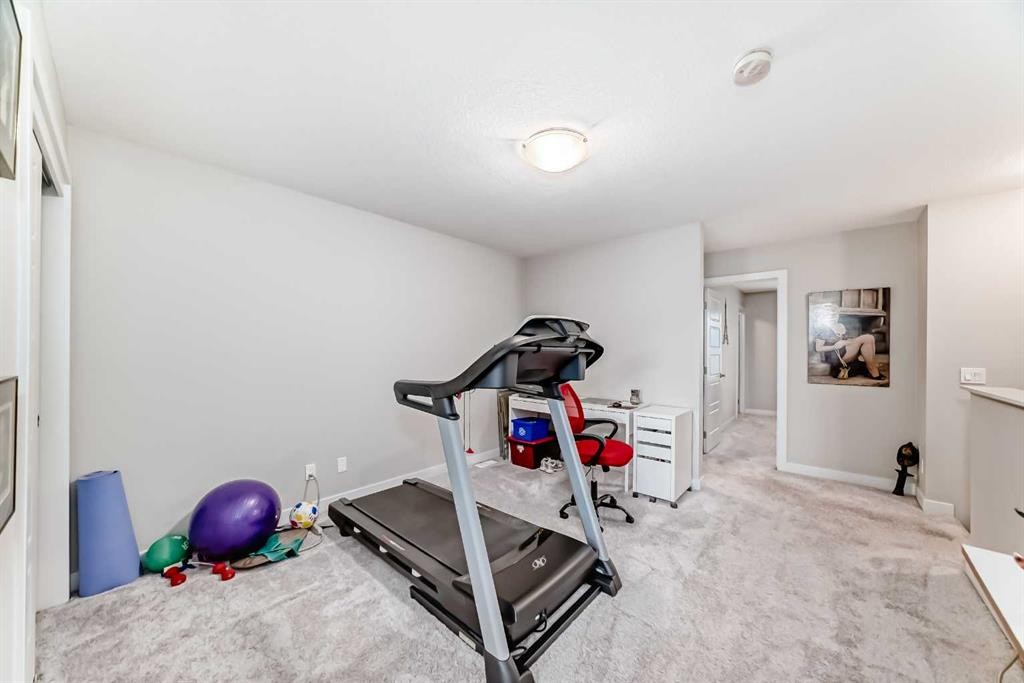 342 Redstone Boulevard Ne, Calgary, AB - Indoor Photo Showing Gym Room