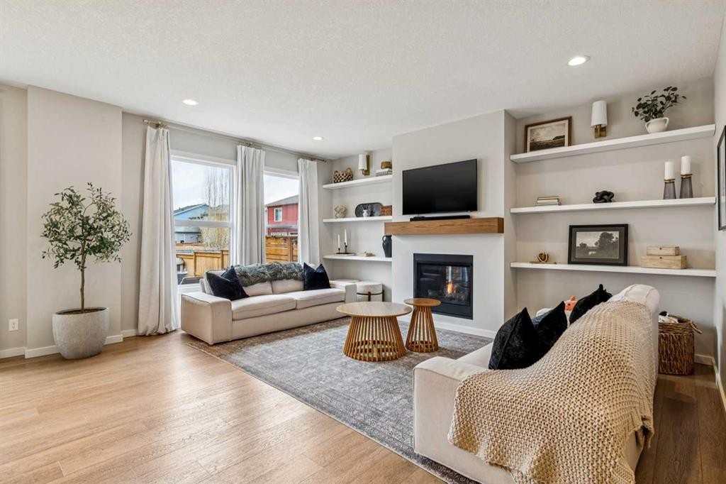 44 Legacy Landing Se, Calgary, AB - Indoor Photo Showing Living Room With Fireplace