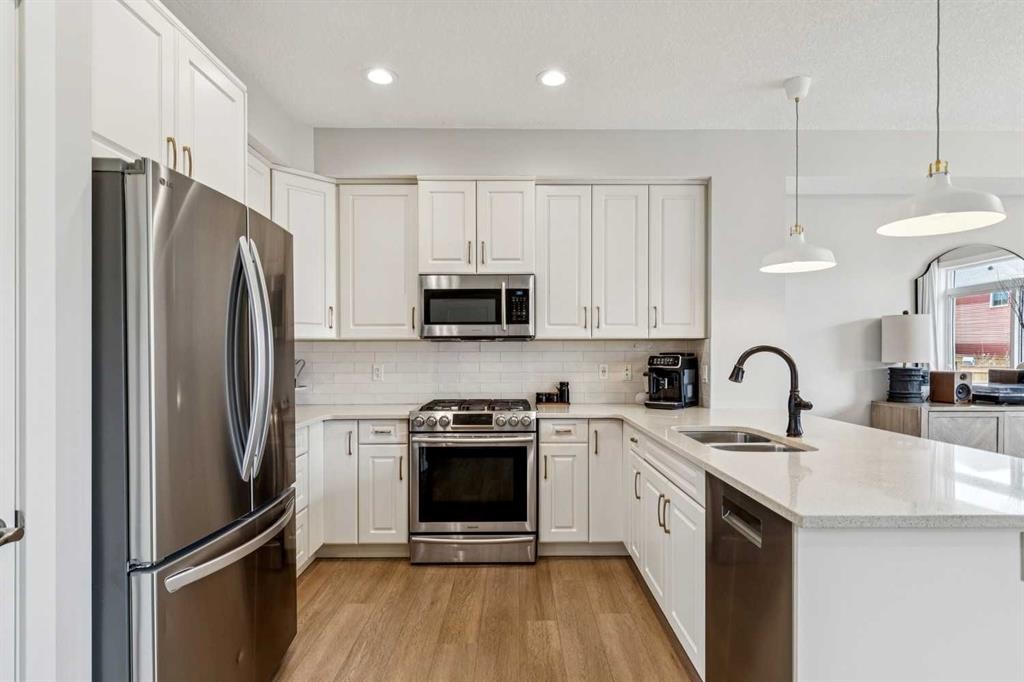 44 Legacy Landing Se, Calgary, AB - Indoor Photo Showing Kitchen With Stainless Steel Kitchen With Double Sink With Upgraded Kitchen