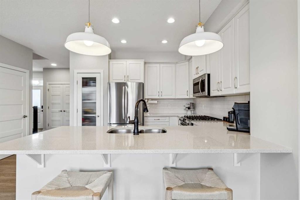 44 Legacy Landing Se, Calgary, AB - Indoor Photo Showing Kitchen With Stainless Steel Kitchen With Double Sink With Upgraded Kitchen