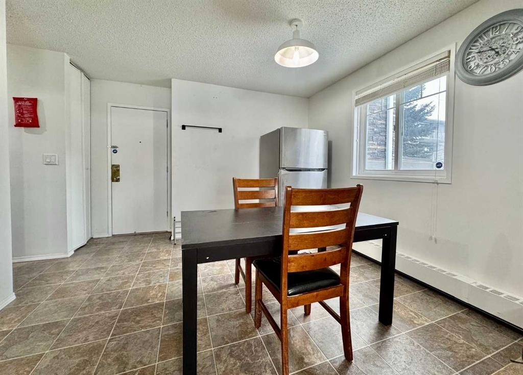 208C-5601 Dalton Drive Nw, Calgary, AB - Indoor Photo Showing Dining Room