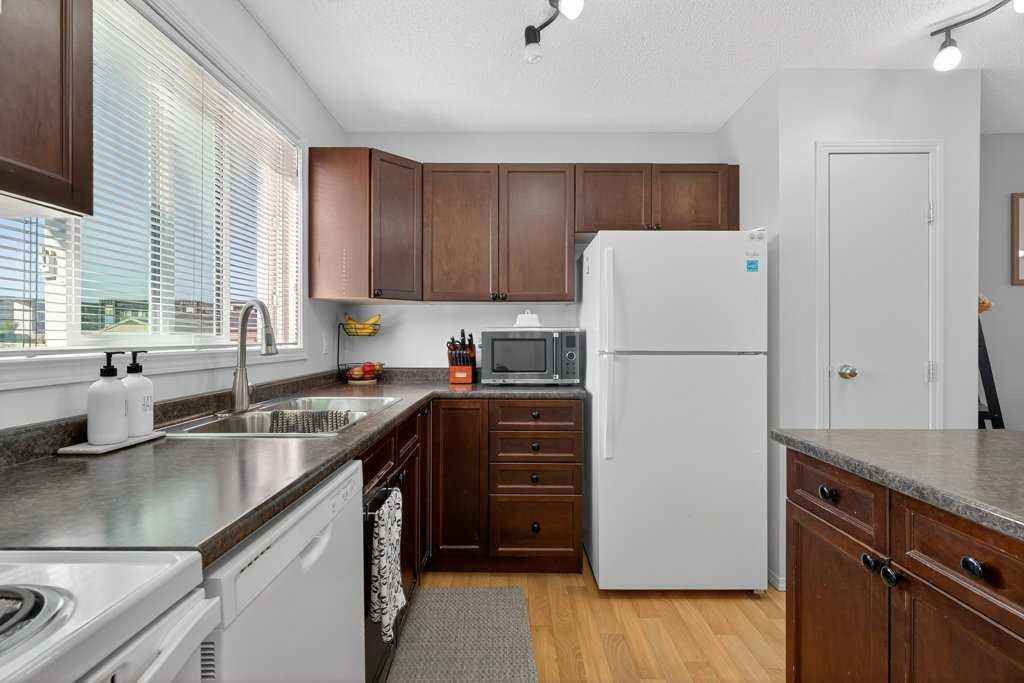 243 Redstone Drive Ne, Calgary, AB - Indoor Photo Showing Kitchen With Double Sink