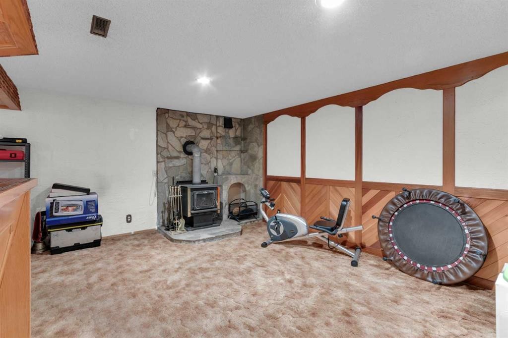 6004 Maddock Drive Ne, Calgary, AB - Indoor With Fireplace