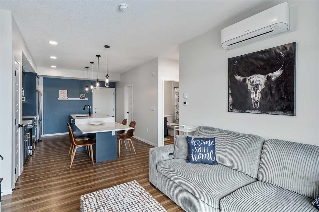 1306-42 Cranbrook Gardens Se, Calgary, AB - Indoor Photo Showing Living Room