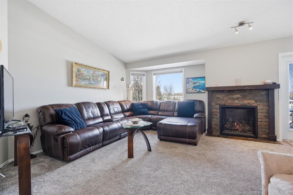 216 Valley Ridge Heights Nw, Calgary, AB - Indoor Photo Showing Living Room With Fireplace