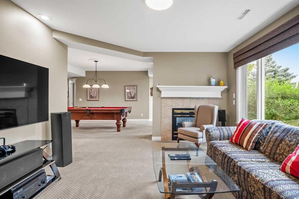 136 Patrick View Sw, Calgary, AB - Indoor With Fireplace