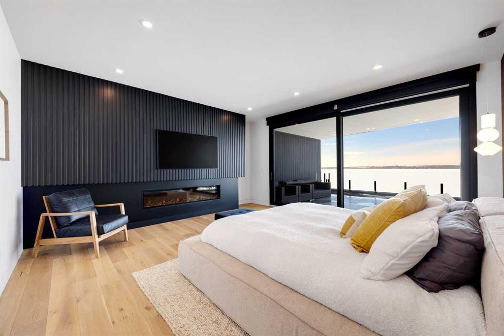 71 Birchcliff Road, Birchcliff, AB - Indoor Photo Showing Bedroom With Fireplace