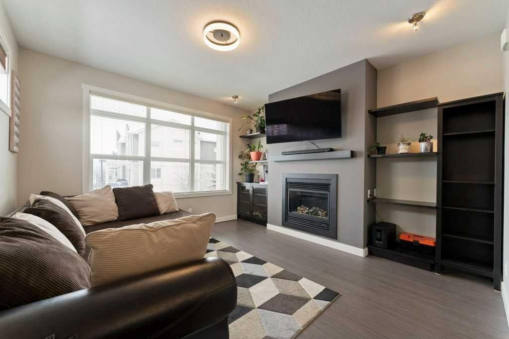 154 Redstone View Ne, Calgary, AB - Indoor Photo Showing Living Room With Fireplace