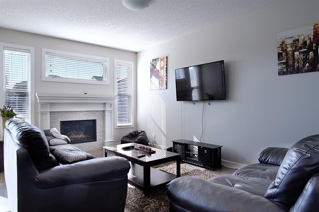 193 Redstone Common Ne, Calgary, AB - Indoor Photo Showing Living Room With Fireplace