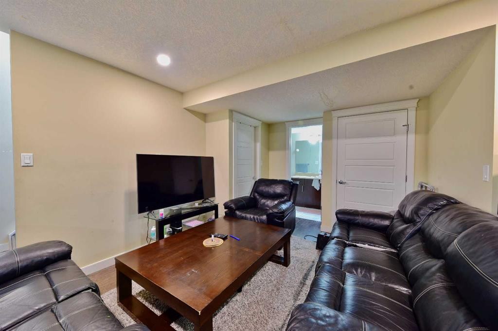 18 Redstone Manor Ne, Calgary, AB - Indoor Photo Showing Living Room