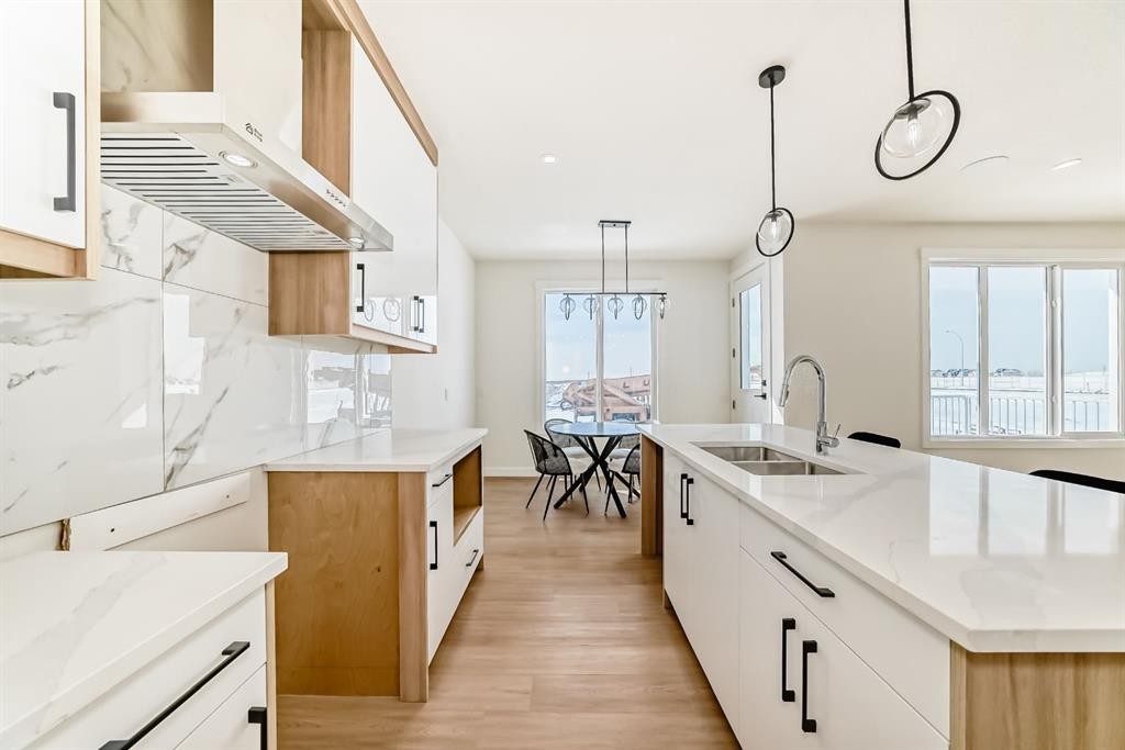 122 Waterstone Way, Chestermere, AB - Indoor Photo Showing Kitchen With Double Sink