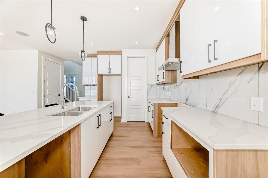 122 Waterstone Way, Chestermere, AB - Indoor Photo Showing Kitchen With Double Sink With Upgraded Kitchen