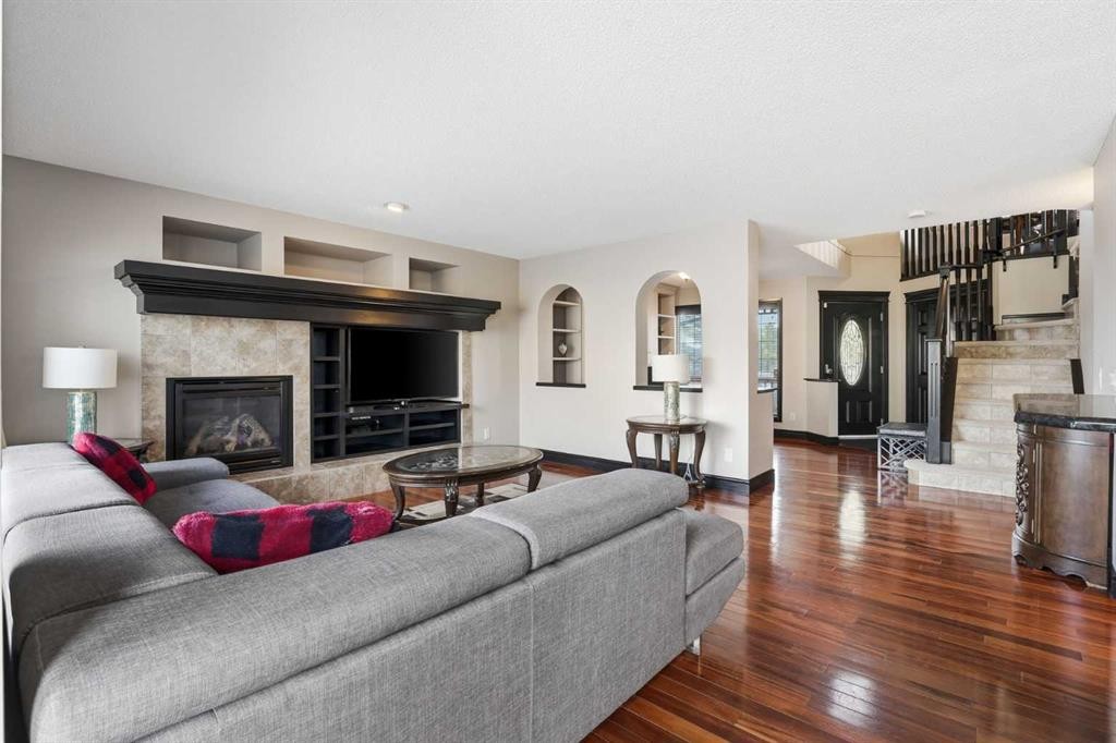 224 Everbrook Way Sw, Calgary, AB - Indoor Photo Showing Living Room With Fireplace