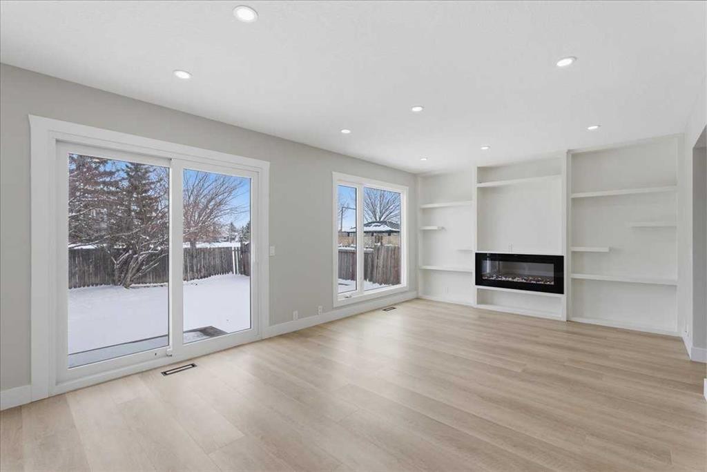 172 Abinger Crescent Ne, Calgary, AB - Indoor Photo Showing Living Room With Fireplace